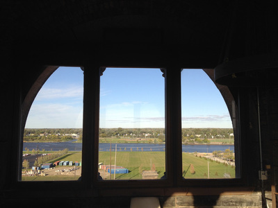 Landscape featuring the river, framed by a stonework arched window with columns